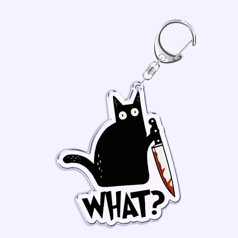 Portachiavi acrilico con gatto nero, coltello e scritta "What is under the cat", perfetto per decorare borse e chiavi.
