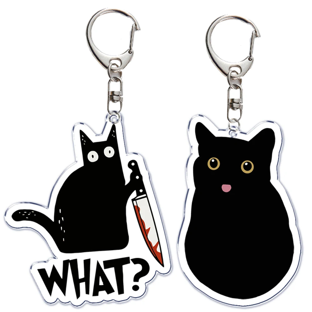 Portachiavi acrilico con gatto nero, coltello e scritta "What is under the cat", perfetto per decorare borse e chiavi.