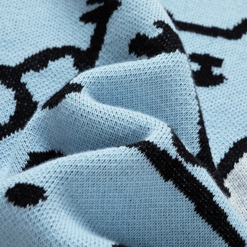 Felpa Premium con gatti cartoon in cotone, disponibile in azzurro cielo o cachi scuro, con gatti delineati in nero e due gatti bianchi. Vestibilità unisex per amanti dei gatti.