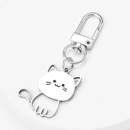 Portachiavi minimalista in metallo argentato con design a forma di gattino stilizzato, perfetto per chiavi, borse e zaini.