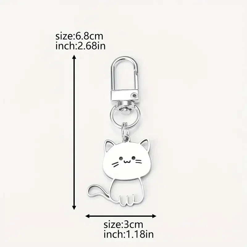Portachiavi minimalista in metallo argentato con design a forma di gattino stilizzato, perfetto per chiavi, borse e zaini.